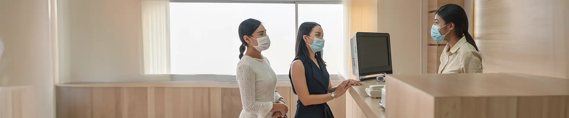 Patients make a payment in a hospital banner compressed
